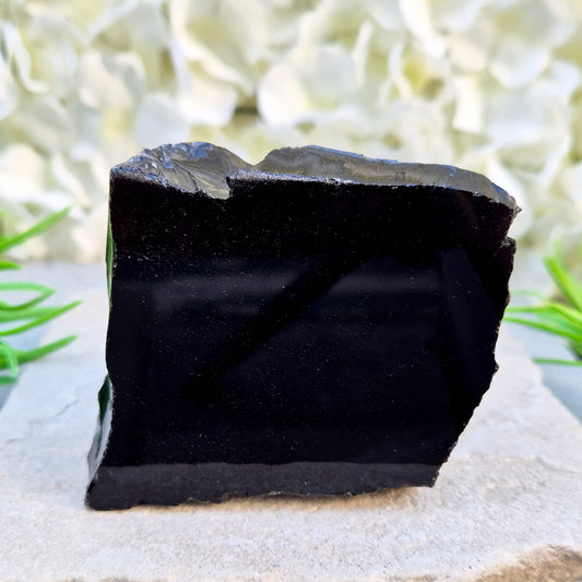 Natural black obsidian freeform from Mexico, known for its grounding presence and protective energy. A striking volcanic glass piece.