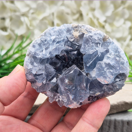 Celestite Cluster with sparkling blue crystals. A beautiful display piece loved for its gentle energy, peaceful presence, and natural beauty.