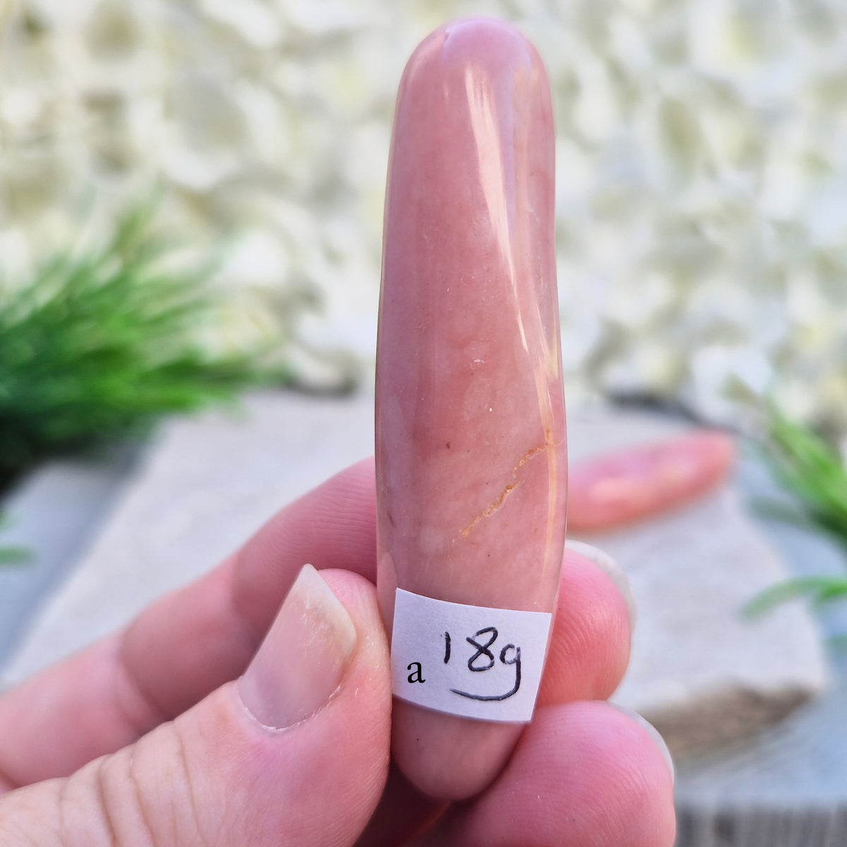 Shop a polished Pink Opal wand in soft, milky pink. Often associated with gentle heart energy and emotional comfort. 
