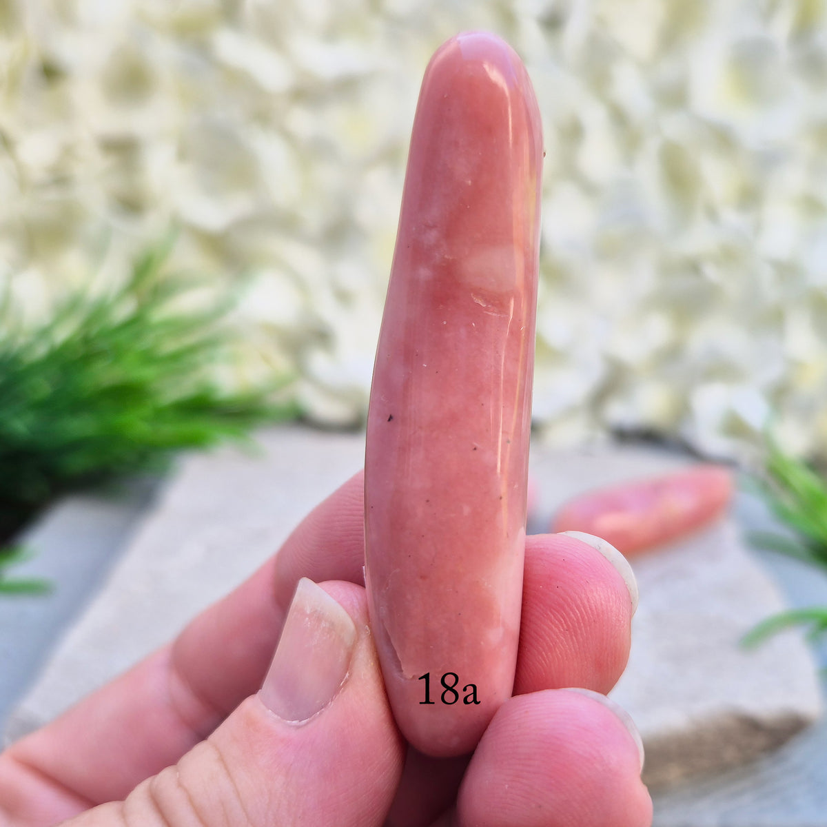 Shop a polished Pink Opal wand in soft, milky pink. Often associated with gentle heart energy and emotional comfort. 