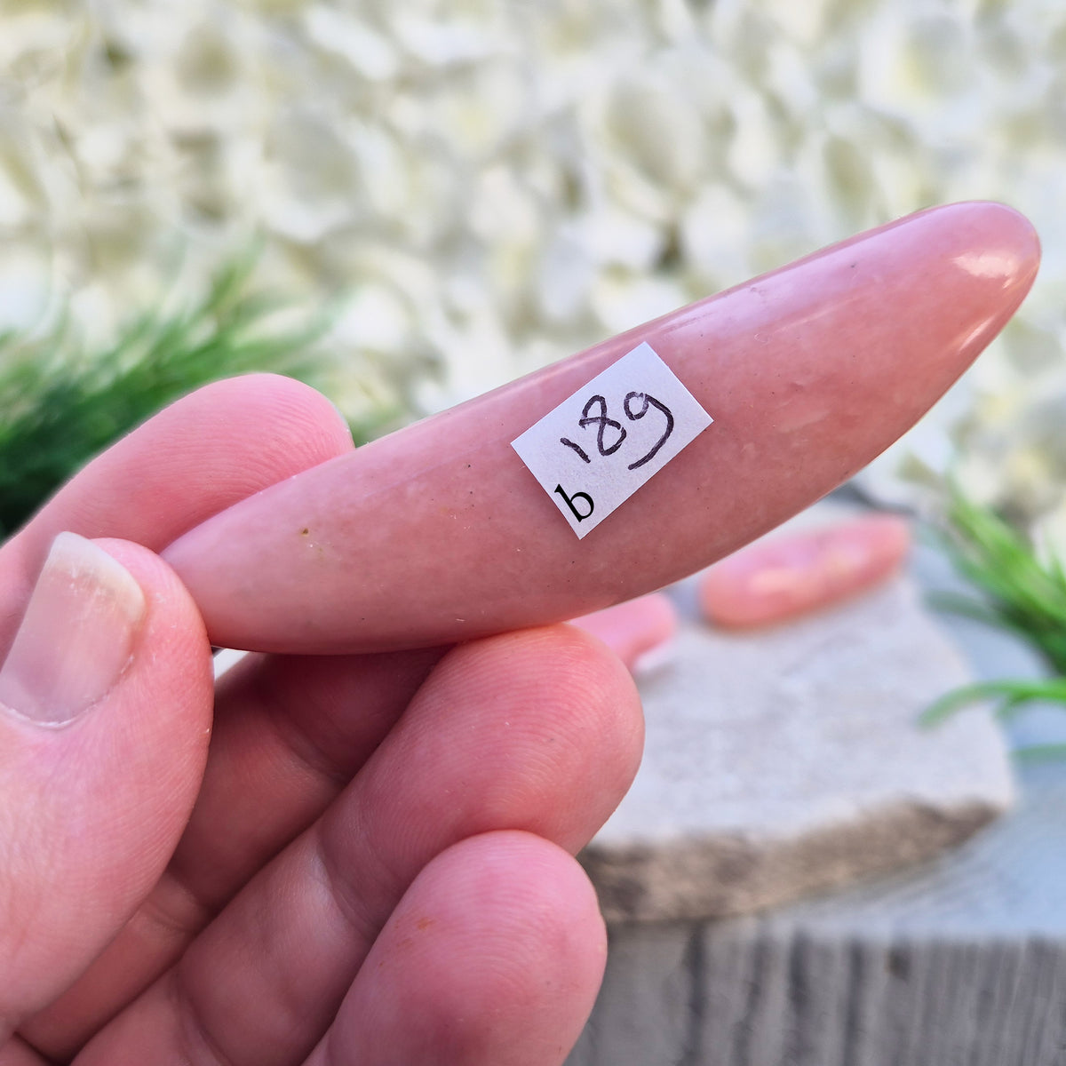 Shop a polished Pink Opal wand in soft, milky pink. Often associated with gentle heart energy and emotional comfort. 