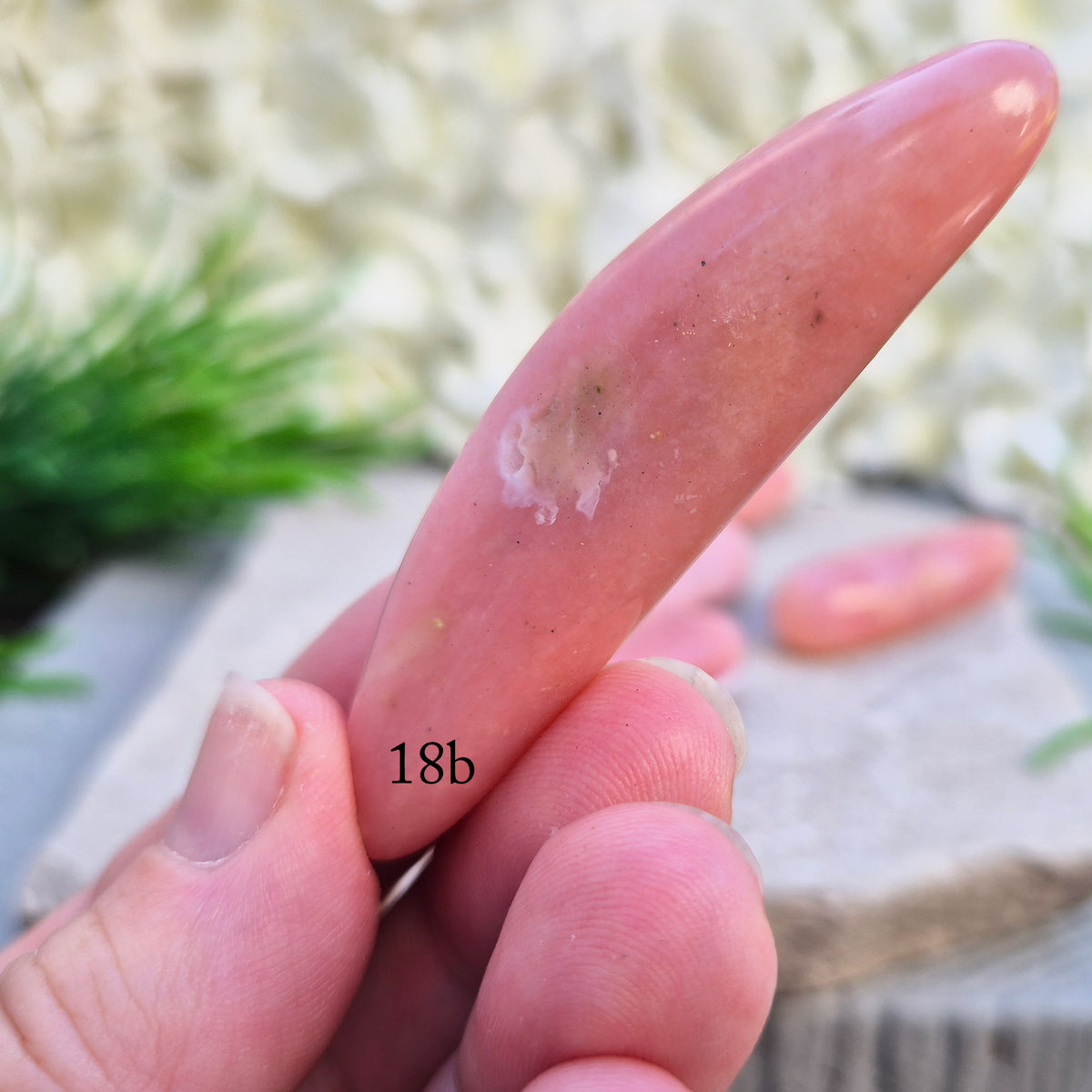 Shop a polished Pink Opal wand in soft, milky pink. Often associated with gentle heart energy and emotional comfort. 