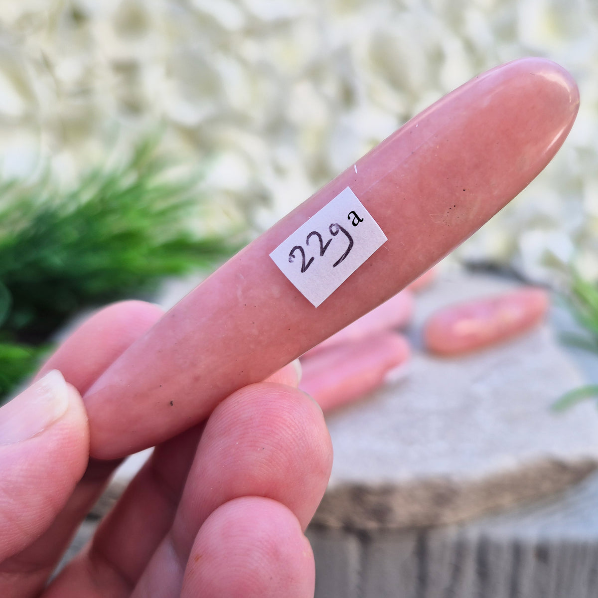 Shop a polished Pink Opal wand in soft, milky pink. Often associated with gentle heart energy and emotional comfort. 