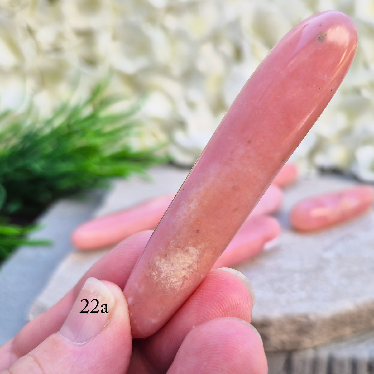 Shop a polished Pink Opal wand in soft, milky pink. Often associated with gentle heart energy and emotional comfort. 