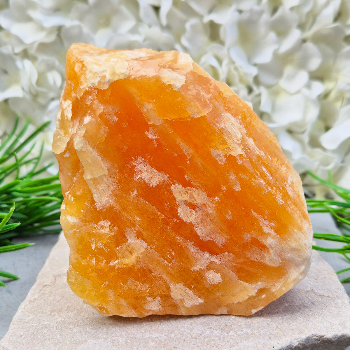 Natural Orange Calcite standing stone from Mexico. A warm, uplifting crystal for motivation, confidence, and brighter, more energised spaces.