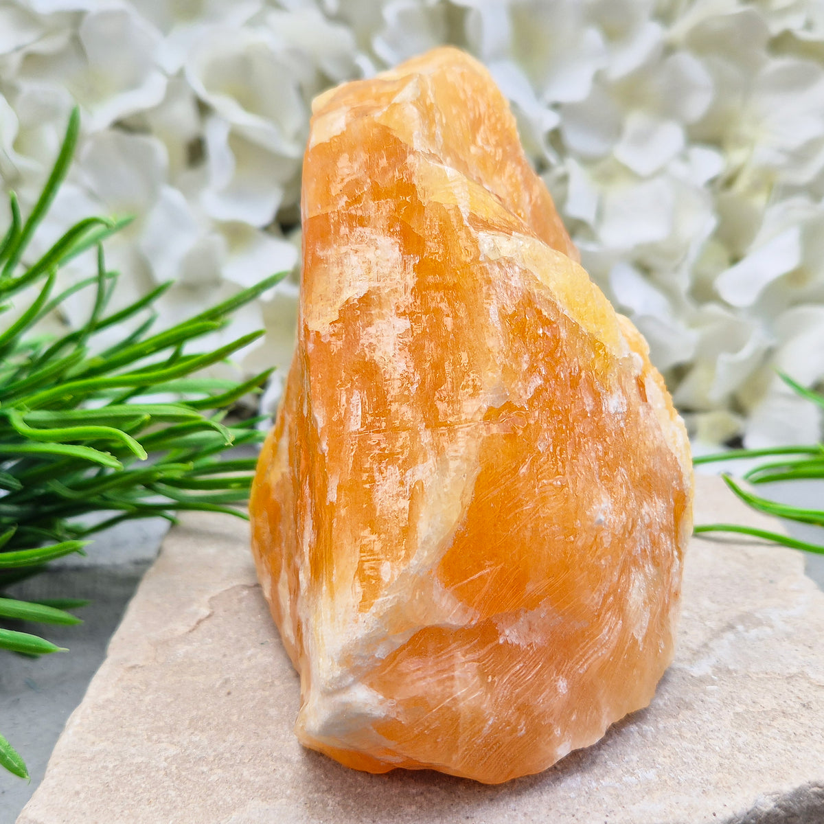 Natural Orange Calcite standing stone from Mexico. A warm, uplifting crystal for motivation, confidence, and brighter, more energised spaces.