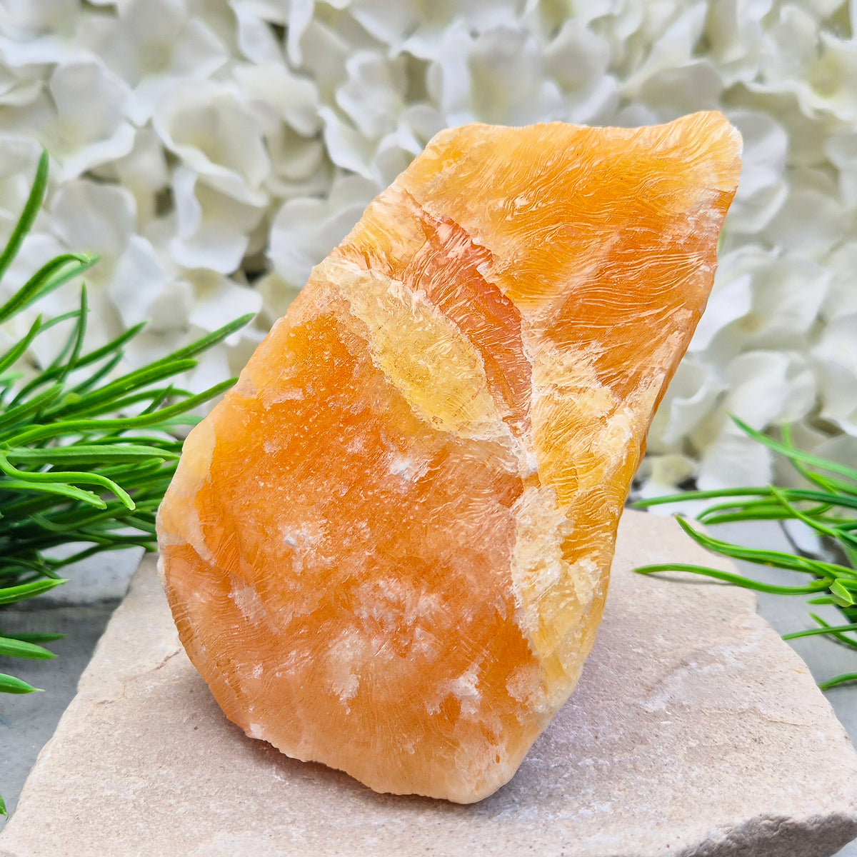 Natural Orange Calcite standing stone from Mexico. A warm, uplifting crystal for motivation, confidence, and brighter, more energised spaces.