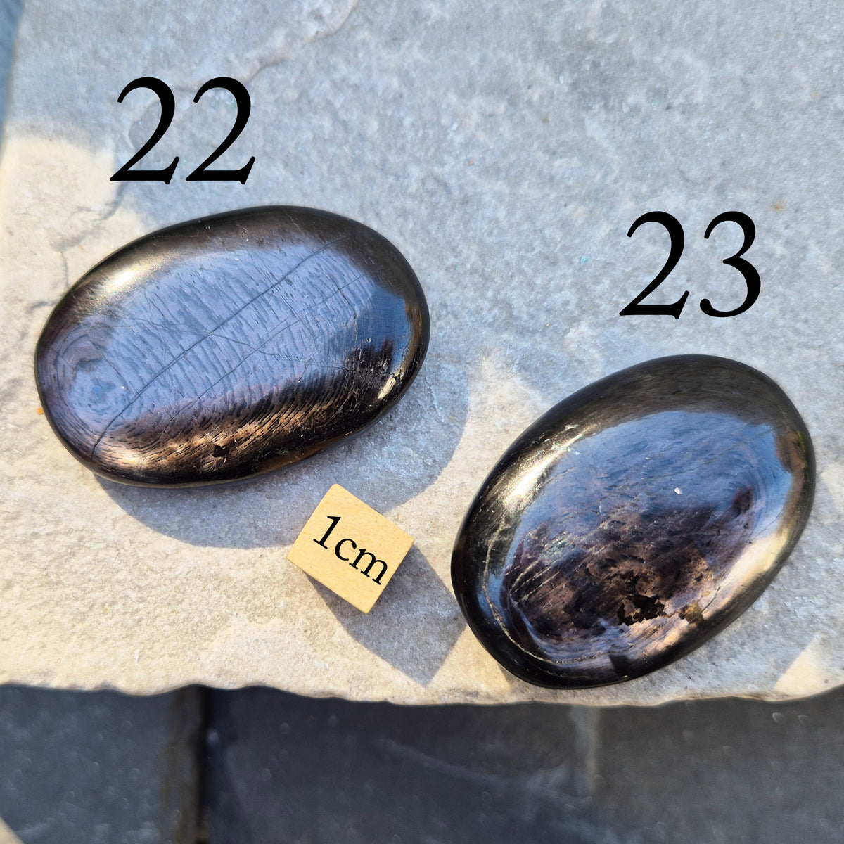 Violet Hypersthene palm stone with a smooth, comforting feel. A grounding crystal often chosen for inner strength, calm focus, and quiet self-reflection.