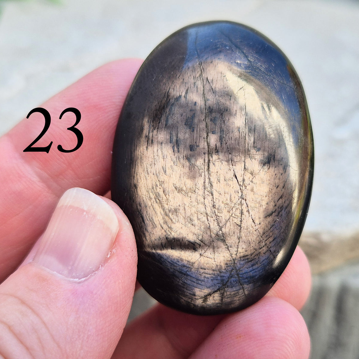 Violet Hypersthene palm stone with a smooth, comforting feel. A grounding crystal often chosen for inner strength, calm focus, and quiet self-reflection.