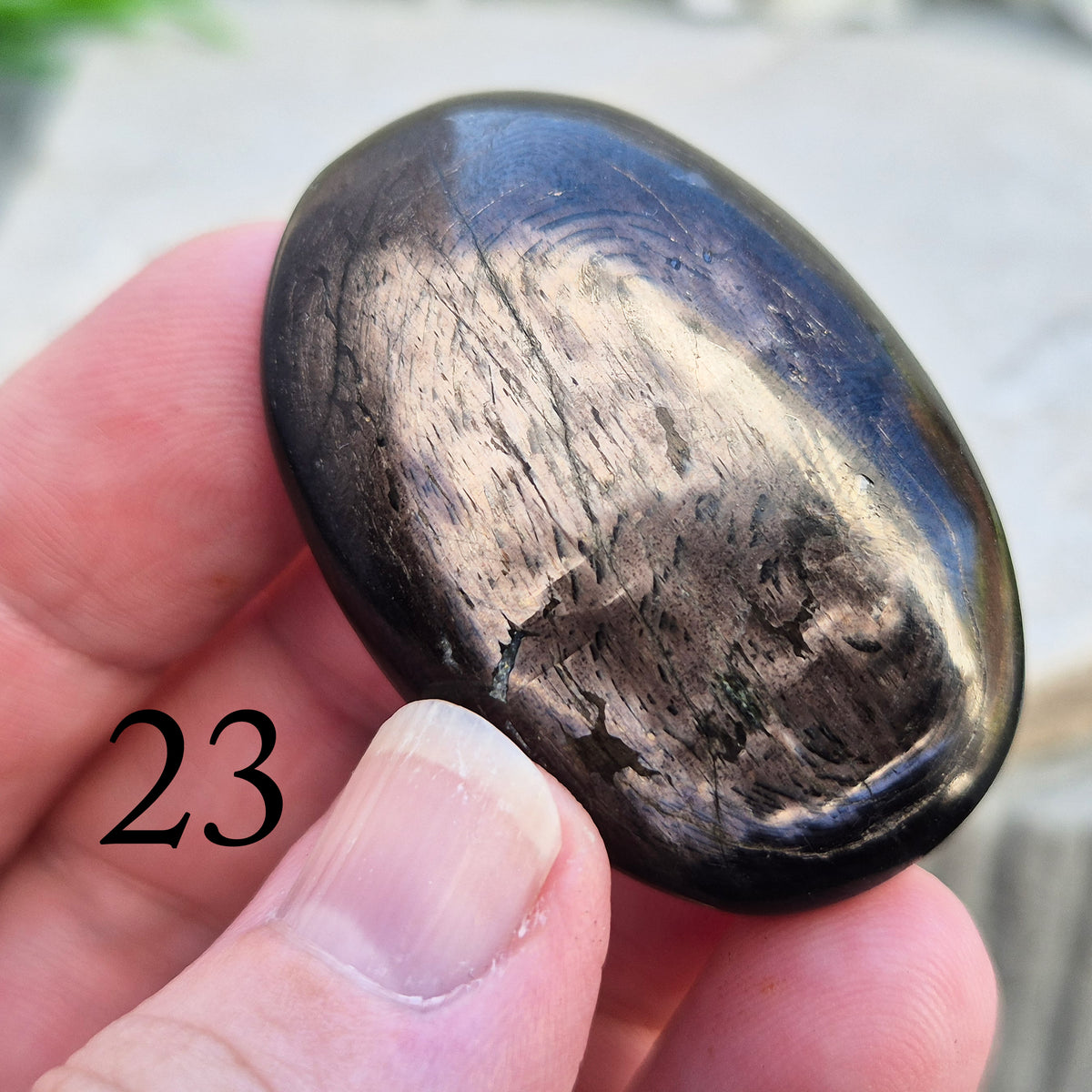 Violet Hypersthene palm stone with a smooth, comforting feel. A grounding crystal often chosen for inner strength, calm focus, and quiet self-reflection.
