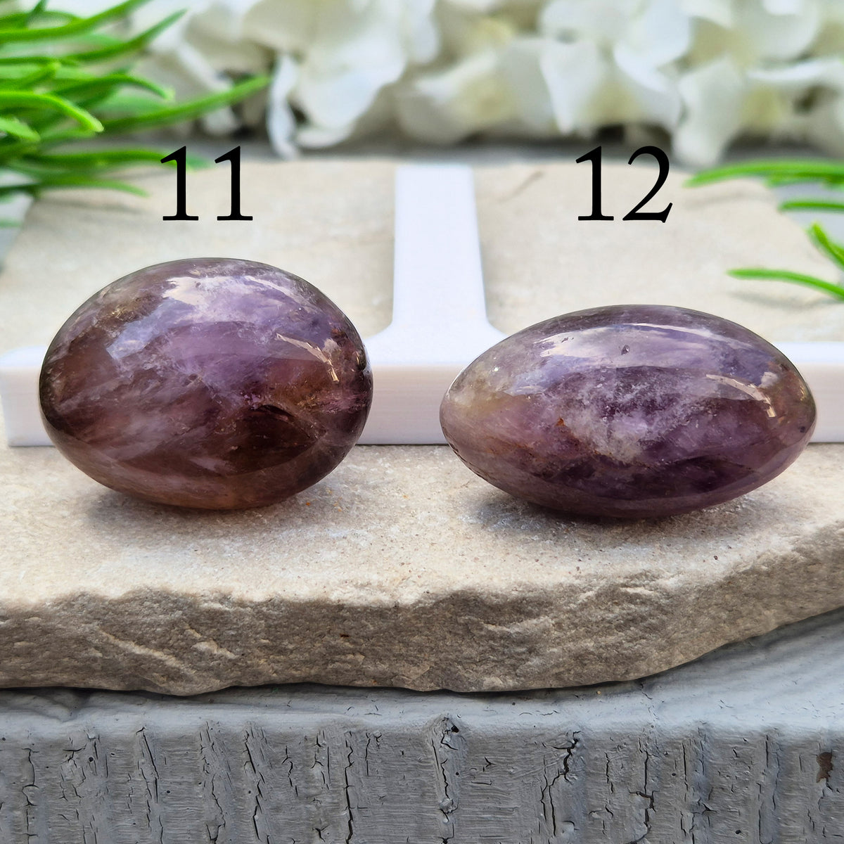 Ametrine polished palm stone with soft purple and golden tones. A natural blend of Amethyst and Citrine with a balanced, easy feel.