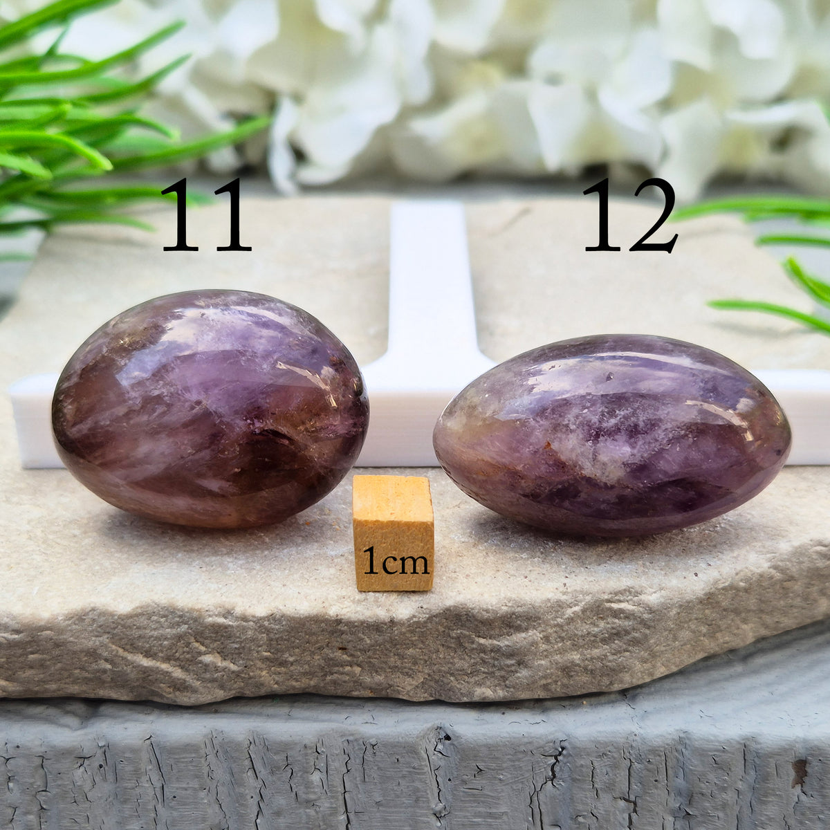 Ametrine polished palm stone with soft purple and golden tones. A natural blend of Amethyst and Citrine with a balanced, easy feel.