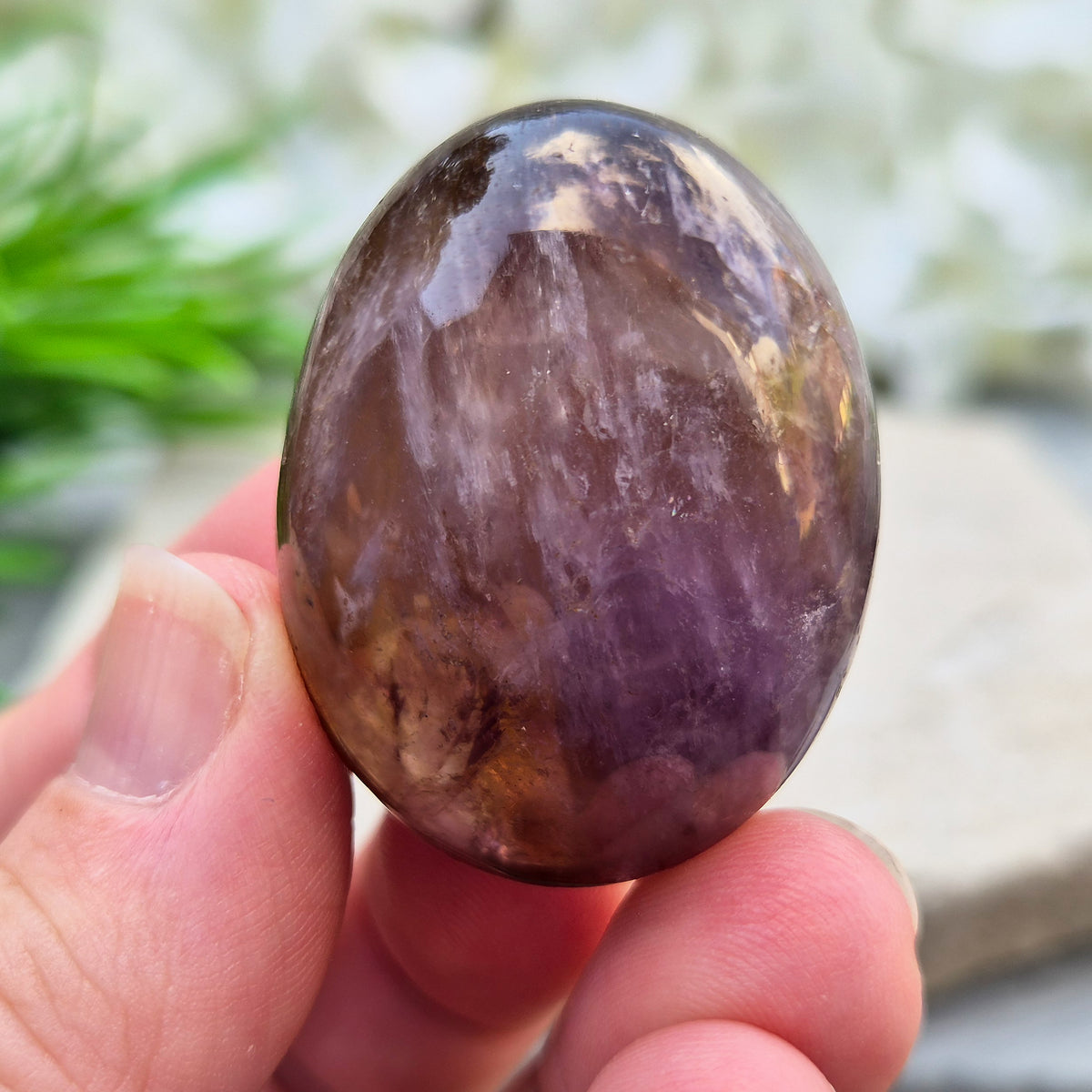 Ametrine polished palm stone with soft purple and golden tones. A natural blend of Amethyst and Citrine with a balanced, easy feel.