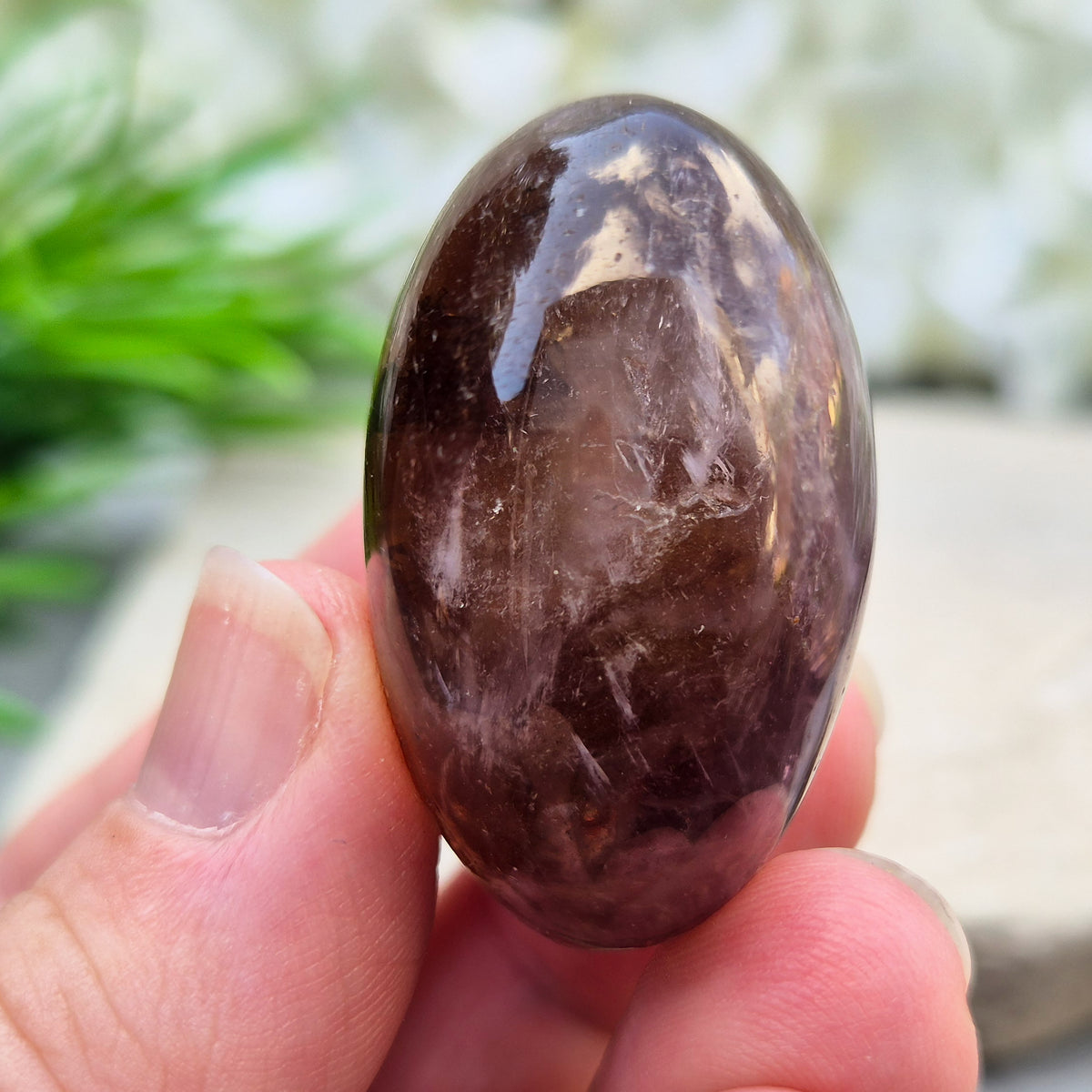 Ametrine polished palm stone with soft purple and golden tones. A natural blend of Amethyst and Citrine with a balanced, easy feel.
