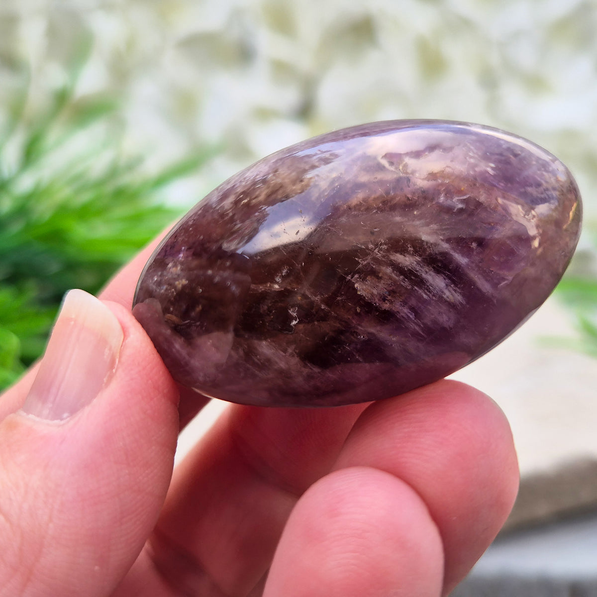 Ametrine polished palm stone with soft purple and golden tones. A natural blend of Amethyst and Citrine with a balanced, easy feel.