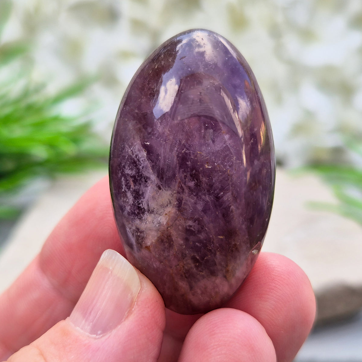 Ametrine polished palm stone with soft purple and golden tones. A natural blend of Amethyst and Citrine with a balanced, easy feel.