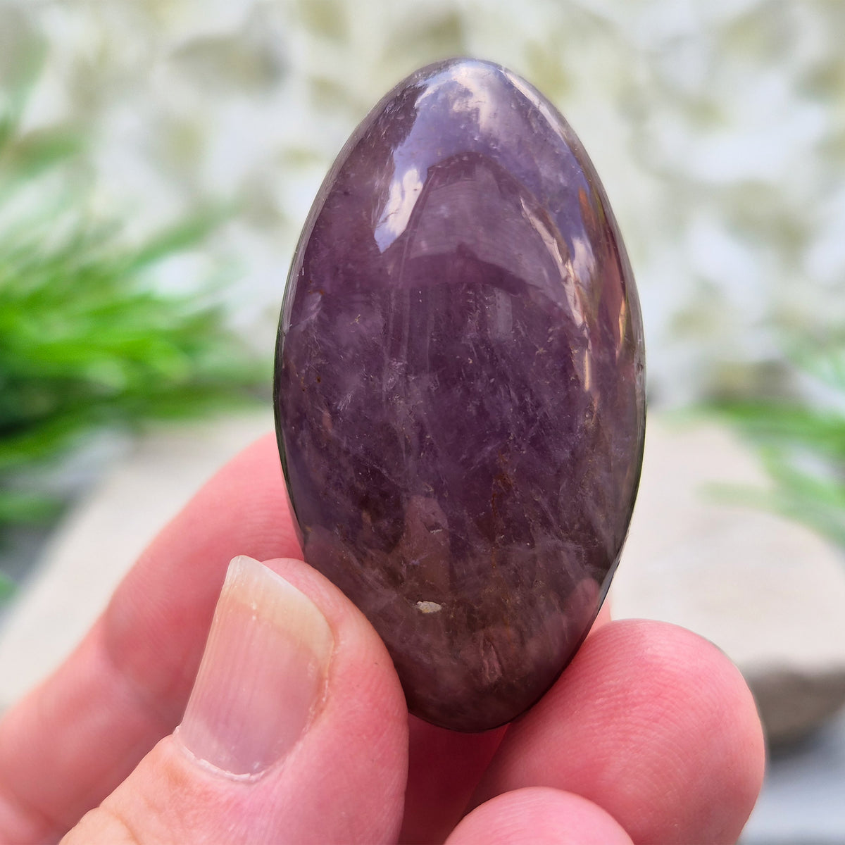 Ametrine polished palm stone with soft purple and golden tones. A natural blend of Amethyst and Citrine with a balanced, easy feel.