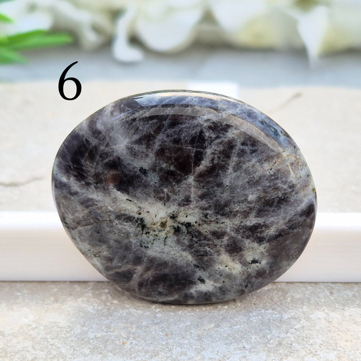 Black Moonstone Palm Stone, valued for its connection to the moon’s energy. Perfect for enhancing intuition, emotional healing, and balancing energy.