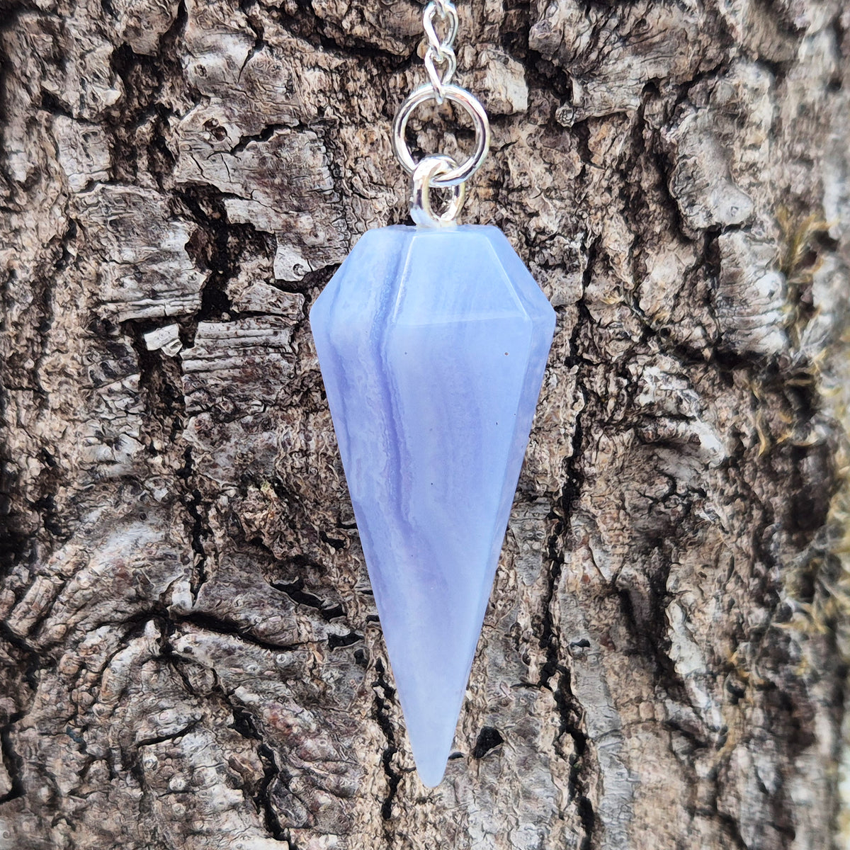 Blue Lace Agate crystal pendulum, known for its calming energy. Ideal for dowsing, spiritual guidance, and bringing a steady, peaceful feel.