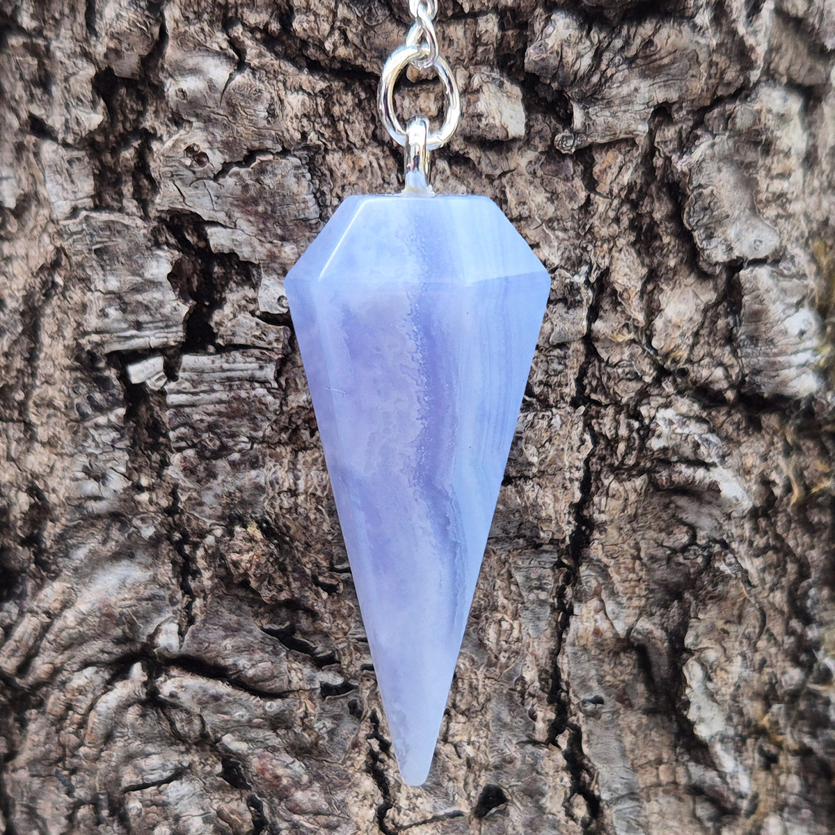 Blue Lace Agate crystal pendulum, known for its calming energy. Ideal for dowsing, spiritual guidance, and bringing a steady, peaceful feel.