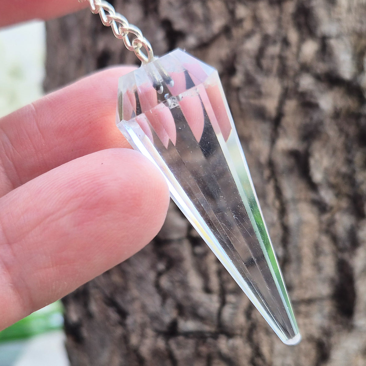 Facet cut shaped quartz crystal pendulum enhancing your dowsing experience, can be used for energy work, healing and during psychic readings. 