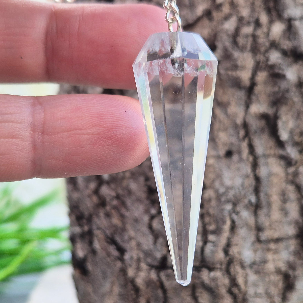 Facet cut shaped quartz crystal pendulum enhancing your dowsing experience, can be used for energy work, healing and during psychic readings. 