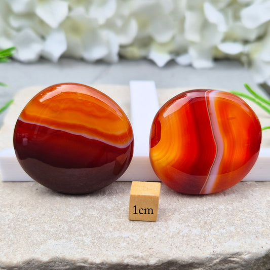 Banded Carnelian palm stone that is said to help Boost motivation, confidence and creativity. Grounding Root and Sacral crystal for energy and focus.
