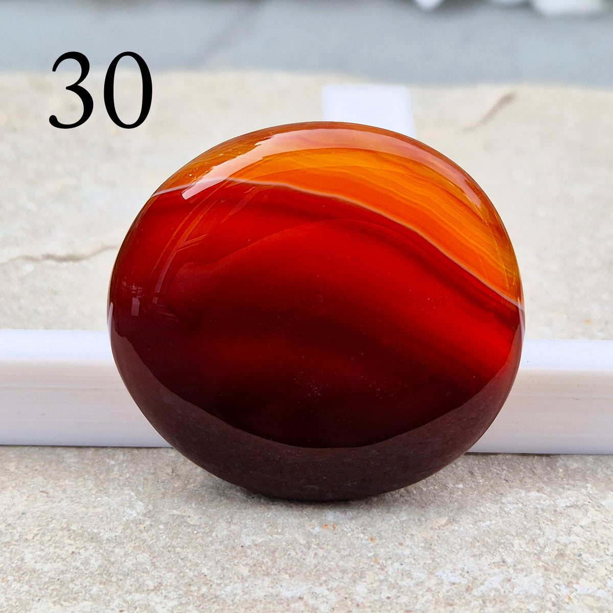 Banded Carnelian palm stone that is said to help Boost motivation, confidence and creativity. Grounding Root and Sacral crystal for energy and focus.