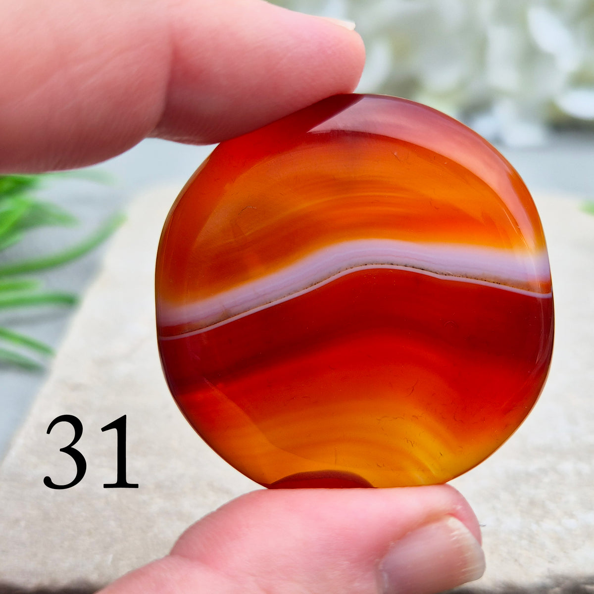 Banded Carnelian palm stone that is said to help Boost motivation, confidence and creativity. Grounding Root and Sacral crystal for energy and focus.