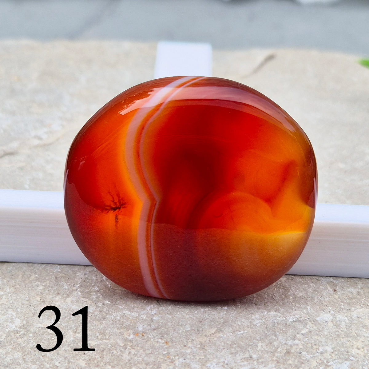 Banded Carnelian palm stone that is said to help Boost motivation, confidence and creativity. Grounding Root and Sacral crystal for energy and focus.