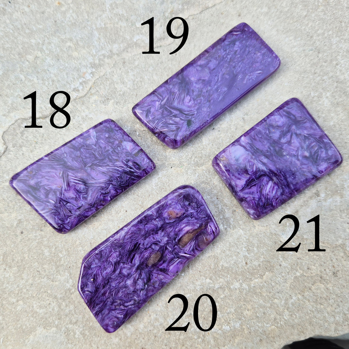 Polished Charoite slice with rich purple swirling patterns. A striking crystal associated with transformation, emotional strength, and personal growth. 