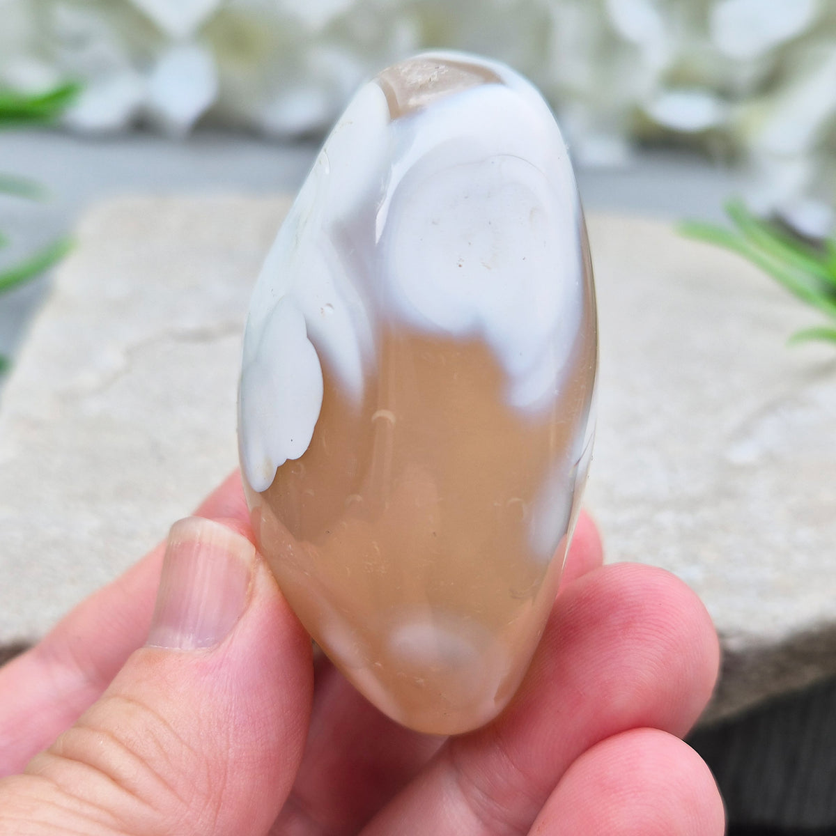 this orca agate has honey-caramel colouring and white markings. No two pieces show the same pattern and colouring.