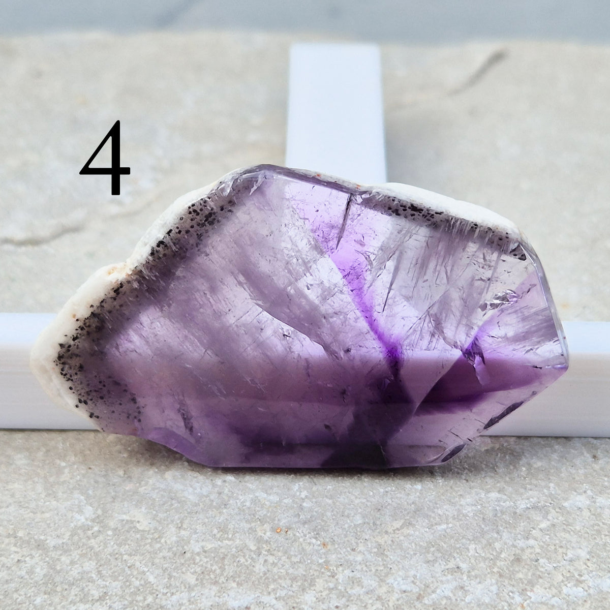 One-of-a-kind Vortex Amethyst slices with a natural trapiche-like radial pattern. Polished amethyst with unique internal colour zoning. Collectors crystal.