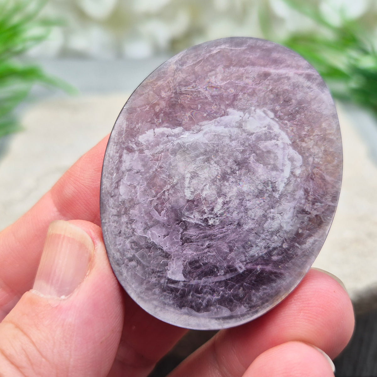 Mica palm stone in shimmering metallic lilac. Perfect for holding, mindful energy, and gifting. Helps steady thoughts, balance emotions, and uplift.