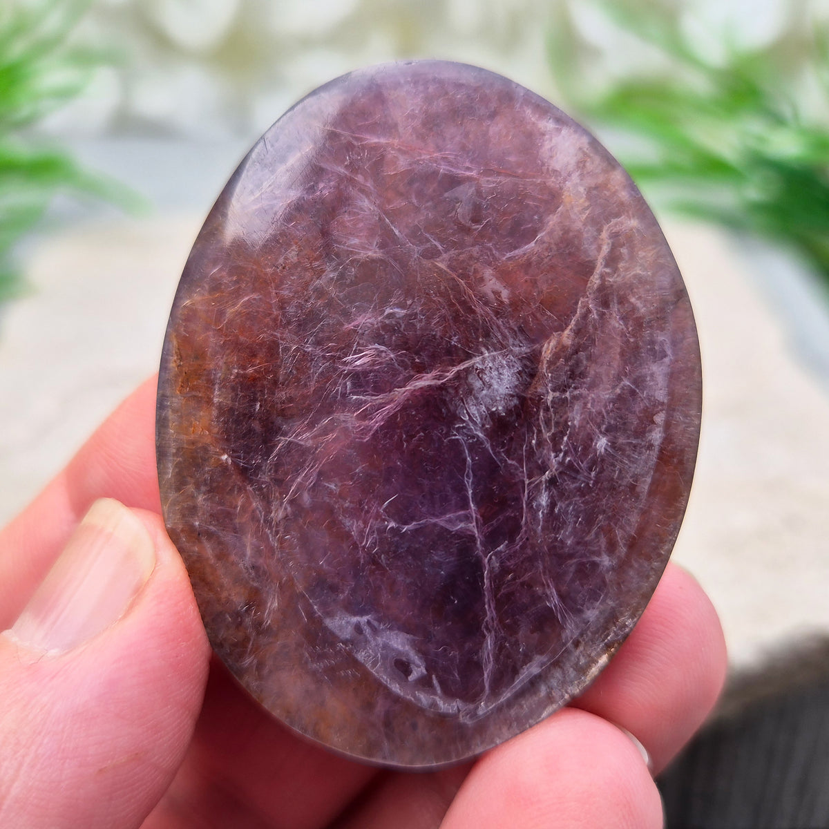 Mica palm stone in shimmering metallic lilac. Perfect for holding, mindful energy, and gifting. Helps steady thoughts, balance emotions, and uplift.