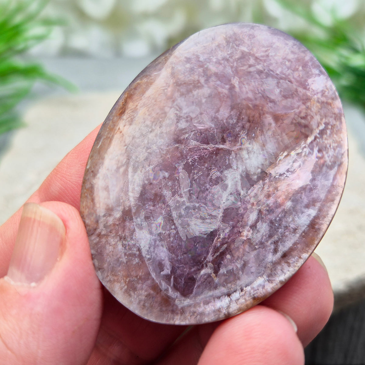 Mica palm stone in shimmering metallic lilac. Perfect for holding, mindful energy, and gifting. Helps steady thoughts, balance emotions, and uplift.