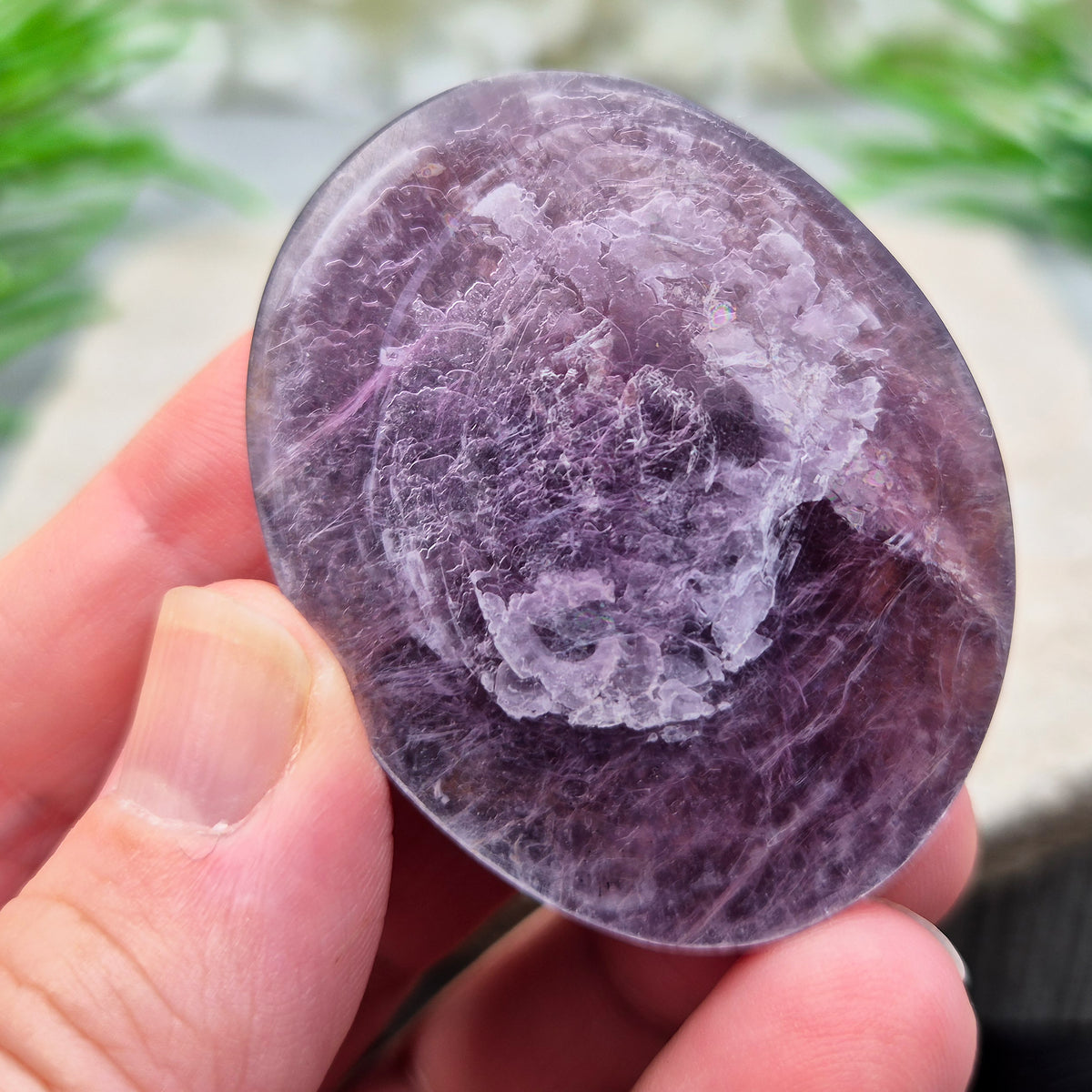 Mica palm stone in shimmering metallic lilac. Perfect for holding, mindful energy, and gifting. Helps steady thoughts, balance emotions, and uplift.