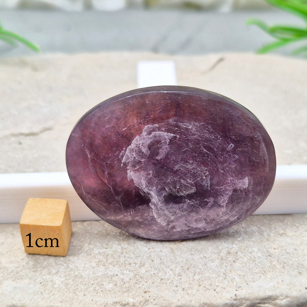 Mica palm stone in shimmering metallic lilac. Perfect for holding, mindful energy, and gifting. Helps steady thoughts, balance emotions, and uplift.