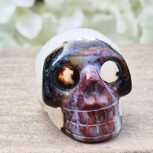 Polished Sardonyx crystal skull. Grounding stone for strength, discipline and protection. Supports focus, stability and confident decision-making.