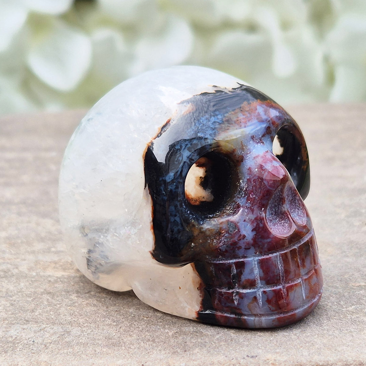 Polished Sardonyx crystal skull. Grounding stone for strength, discipline and protection. Supports focus, stability and confident decision-making.