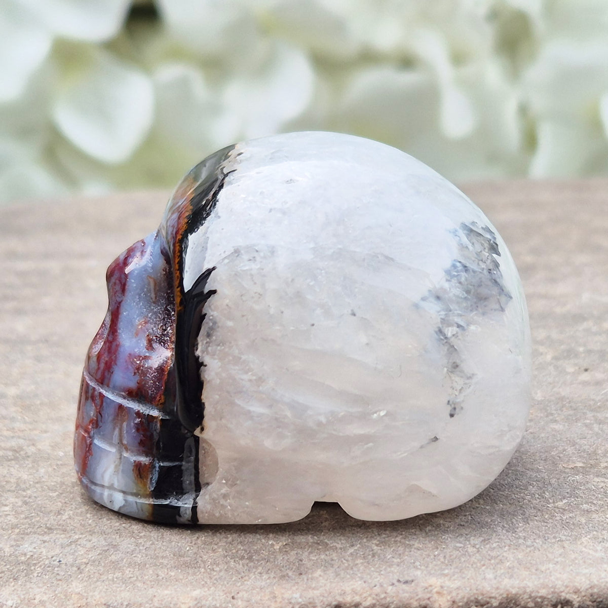 Polished Sardonyx crystal skull. Grounding stone for strength, discipline and protection. Supports focus, stability and confident decision-making.