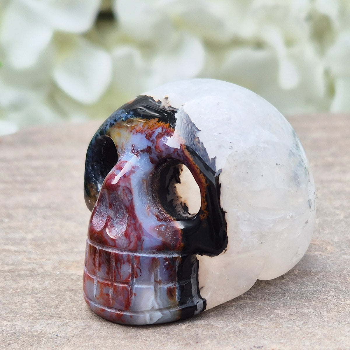 Polished Sardonyx crystal skull. Grounding stone for strength, discipline and protection. Supports focus, stability and confident decision-making.