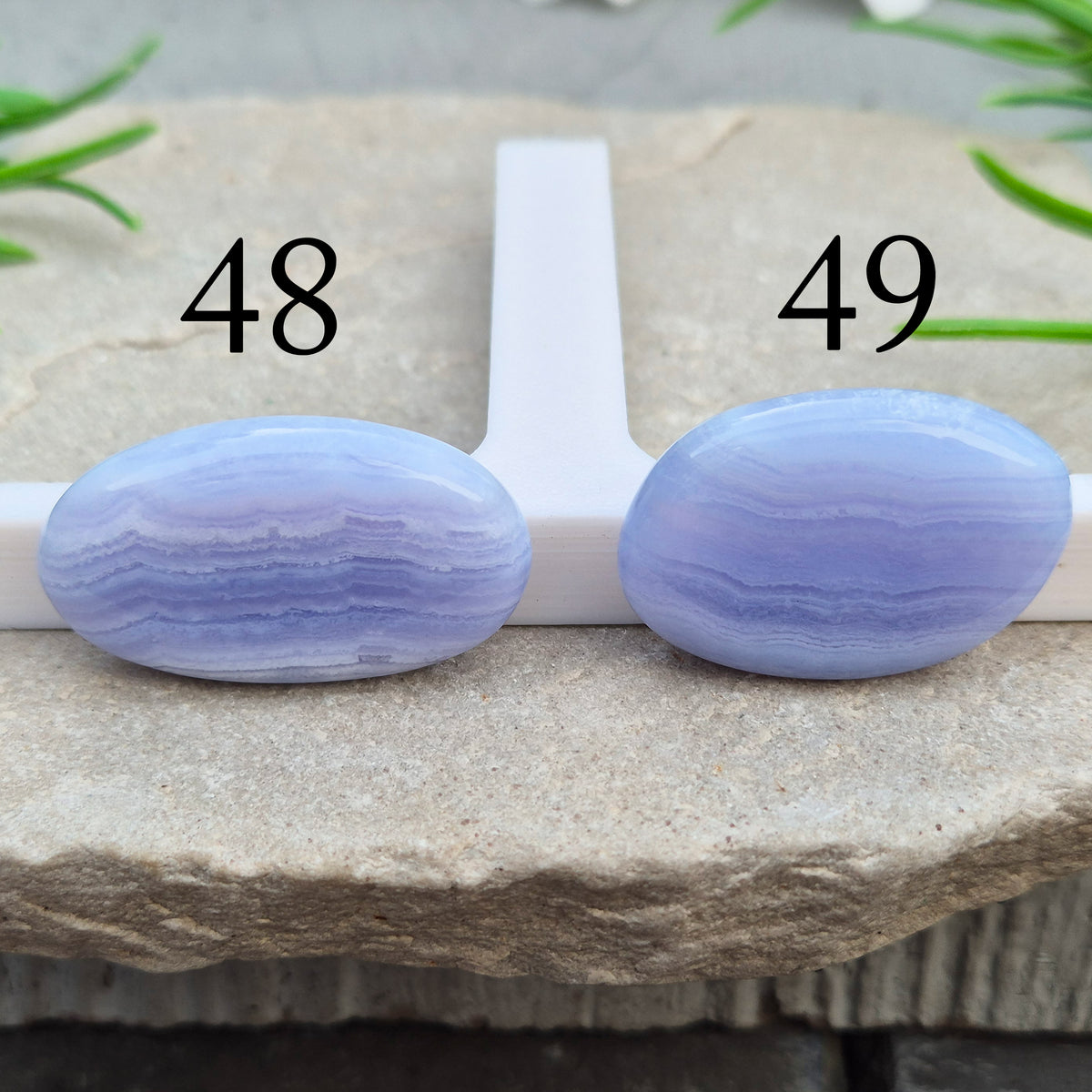Polished Blue Lace Agate crystal palm stone with wonderful banding. A calming crystal, ideal for relaxation, clear communication and gentle healing. 