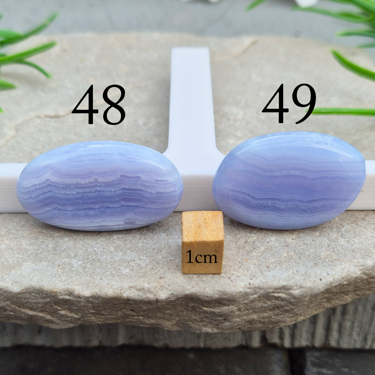 Polished Blue Lace Agate crystal palm stone with wonderful banding. A calming crystal, ideal for relaxation, clear communication and gentle healing. 