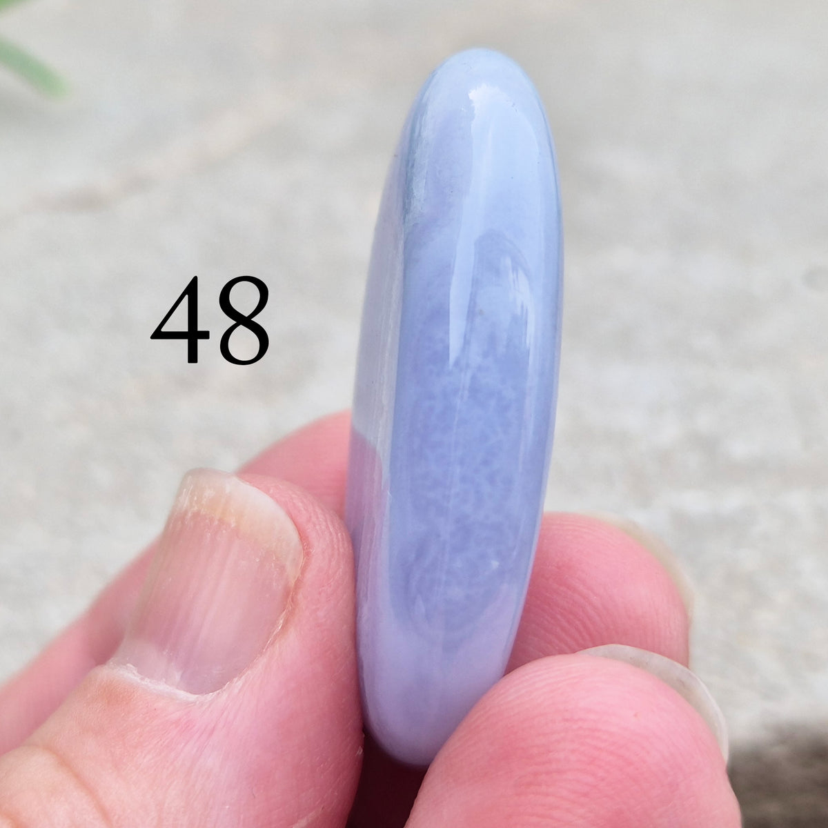 Polished Blue Lace Agate crystal palm stone with wonderful banding. A calming crystal, ideal for relaxation, clear communication and gentle healing. 