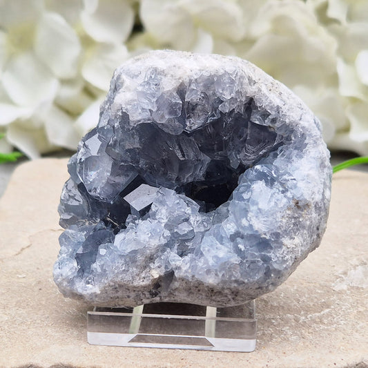 Celestite cluster from Madagascar. A calming, uplifting crystal for peace, creativity, spiritual connection, and angelic guidance. Comes with a stand.
