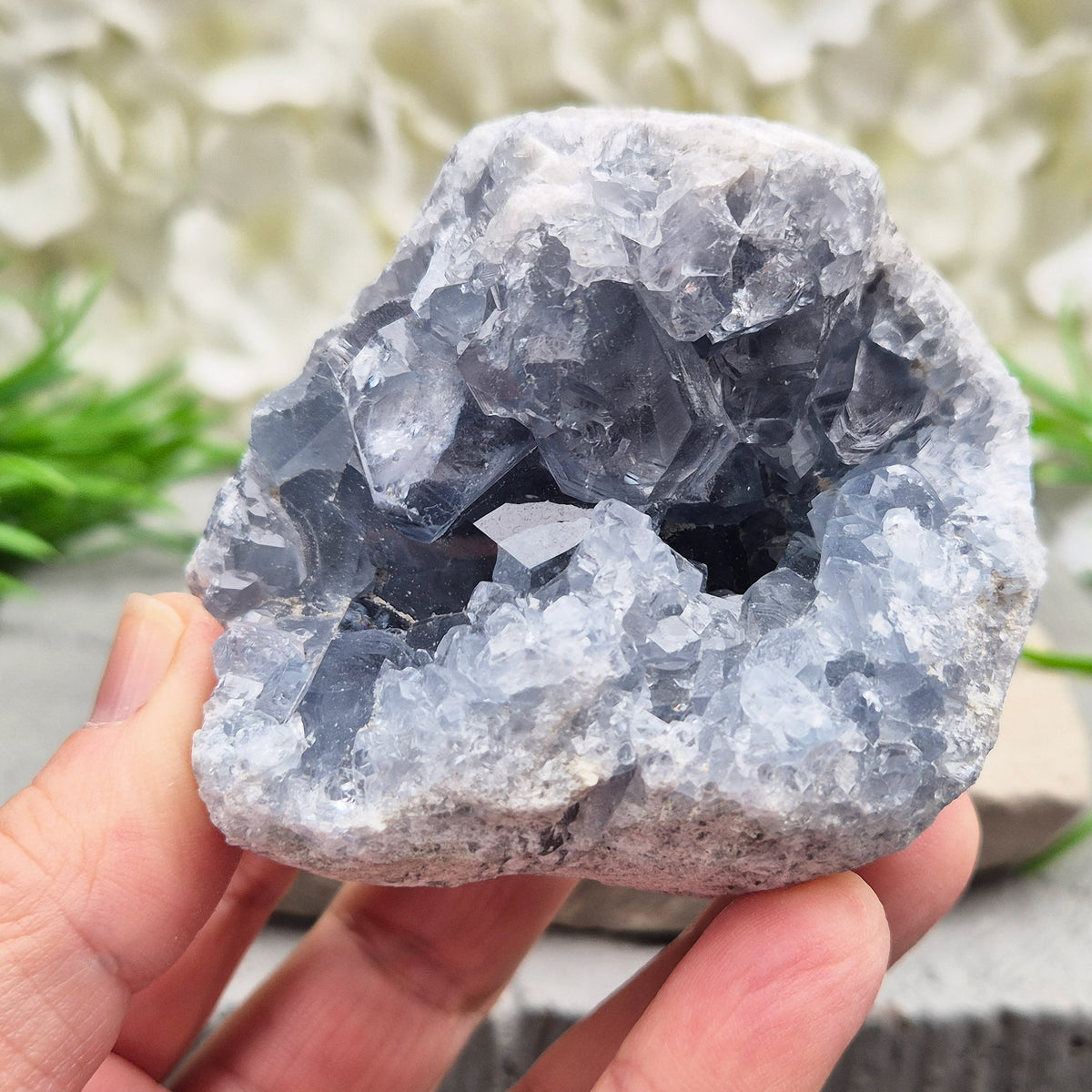 Celestite cluster from Madagascar. A calming, uplifting crystal for peace, creativity, spiritual connection, and angelic guidance. Comes with a stand.