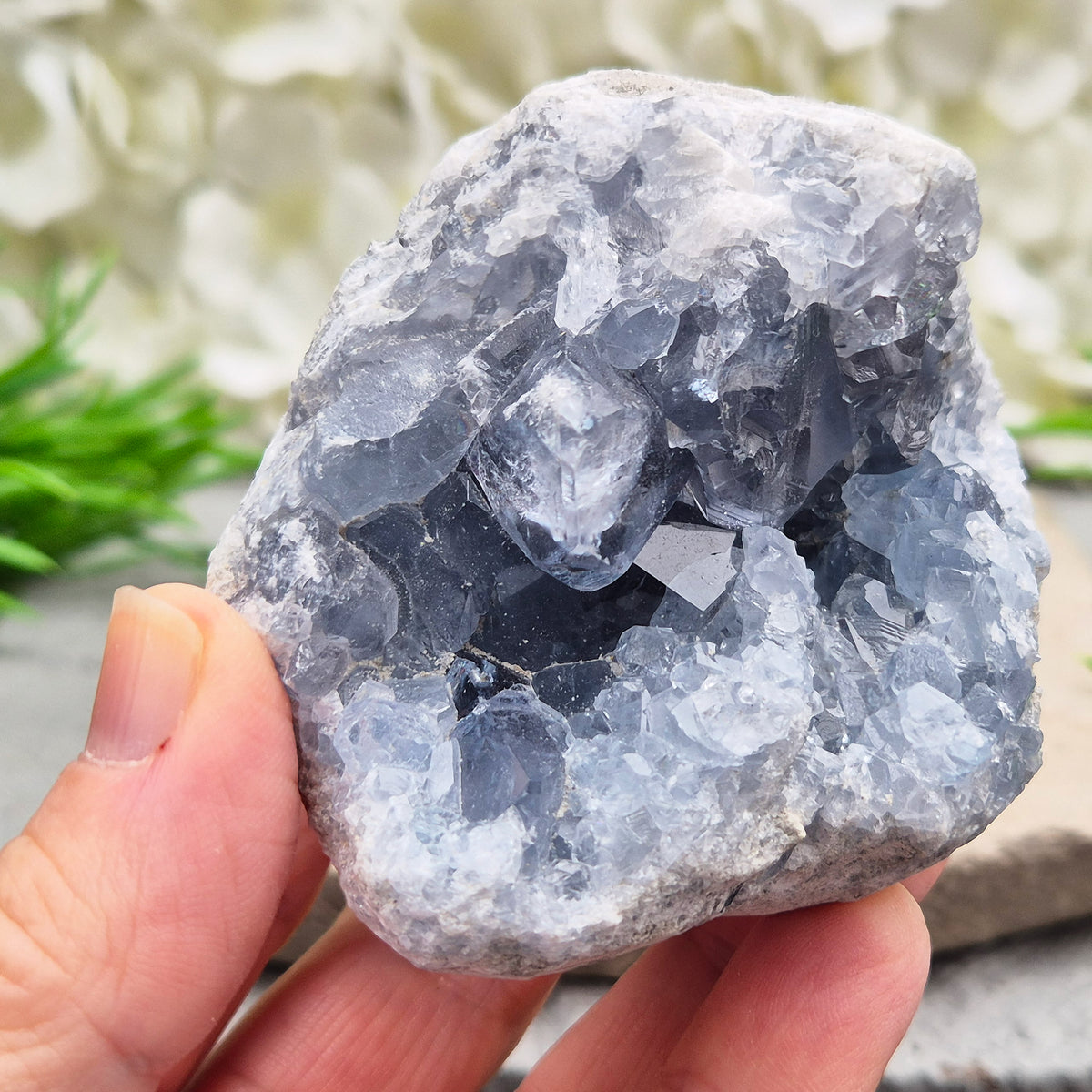 Celestite cluster from Madagascar. A calming, uplifting crystal for peace, creativity, spiritual connection, and angelic guidance. Comes with a stand.
