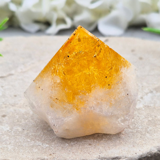 Citrine crystal standing point from Brazil with a polished tip and natural sides. Associated with confidence, motivation, positivity, and personal growth.
