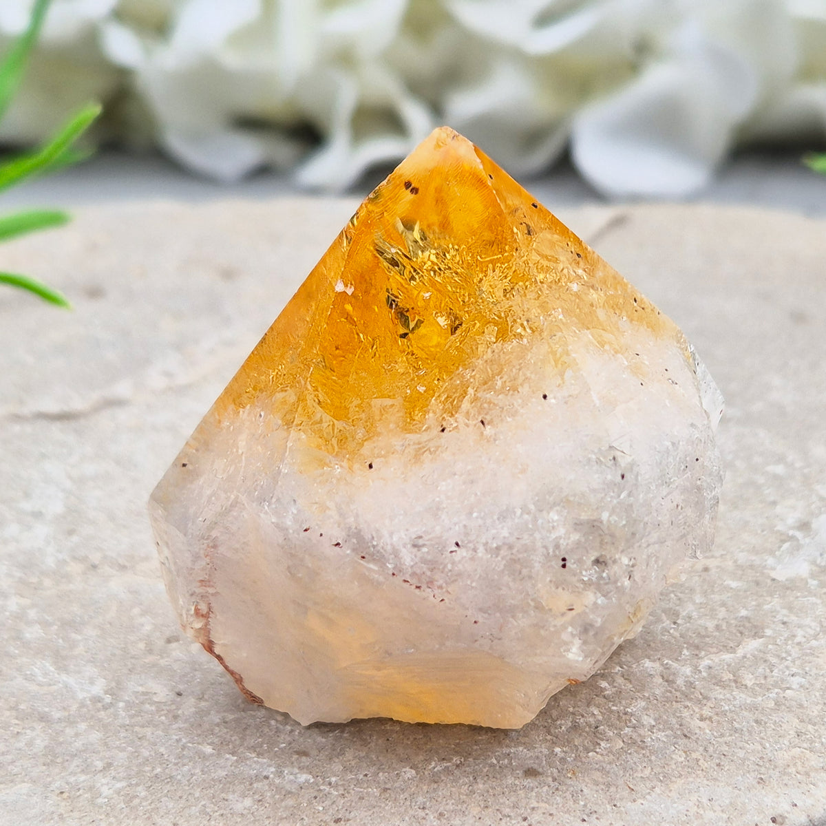 Citrine crystal standing point from Brazil with a polished tip and natural sides. Associated with confidence, motivation, positivity, and personal growth.